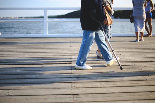 senior citizen walking on deck